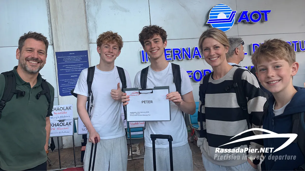 A happy family met by their private airport transfer driver at Phuket International Airport HKT before heading to Rassada Pier for their boat to Phi Phi Island, featuring their name sign PETER